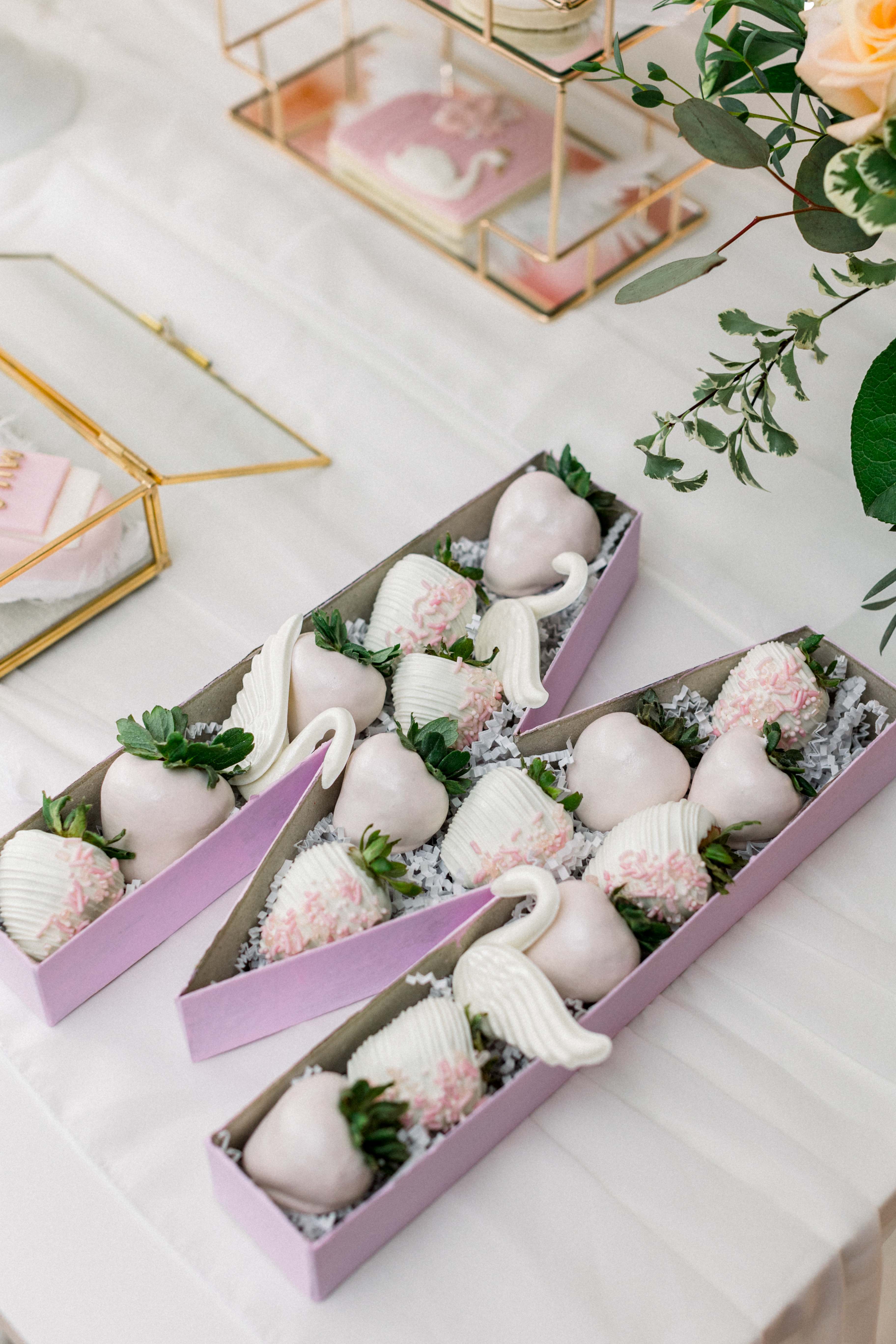 Letter E shaped arrangement of chocolate covered strawberries