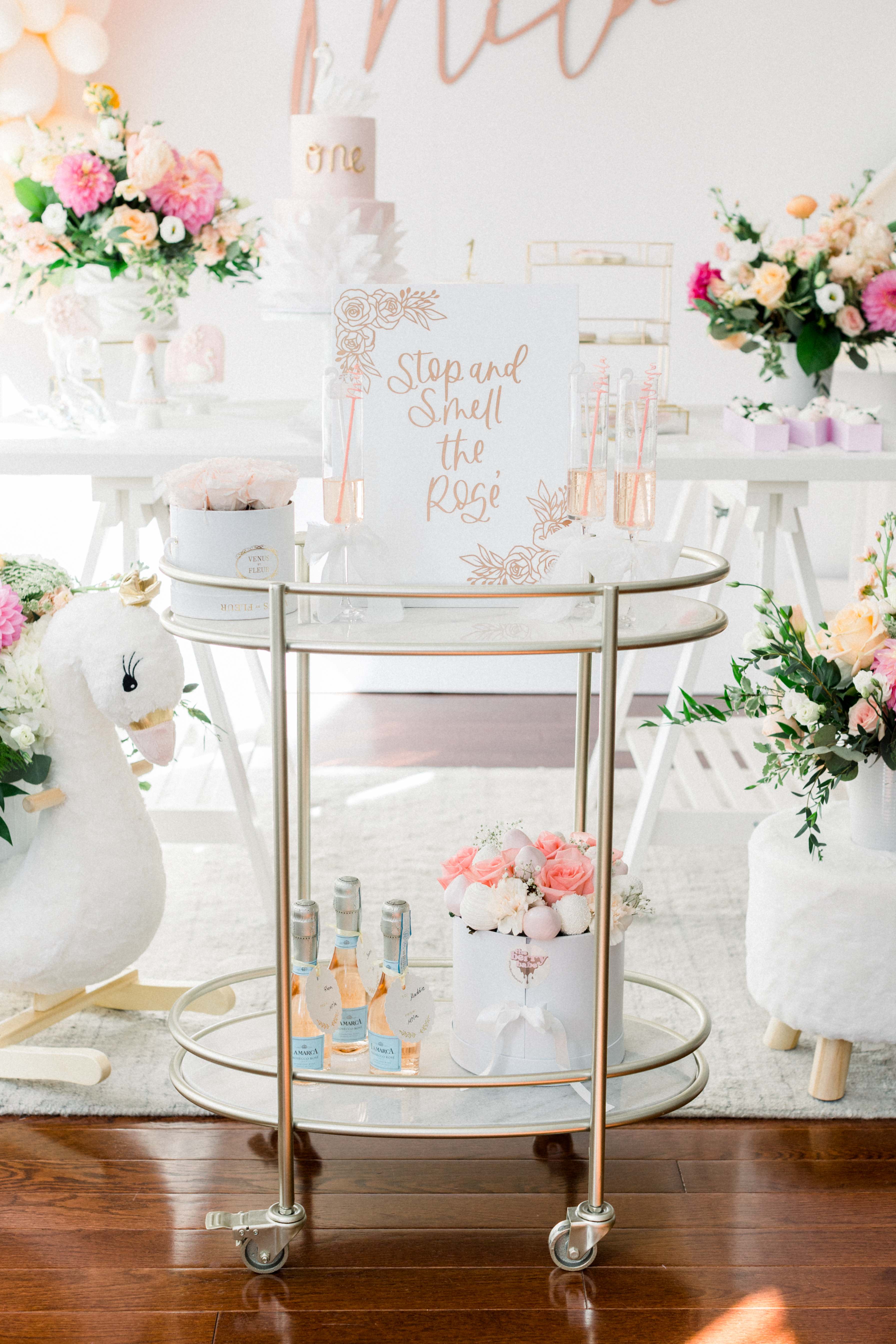 Elegant event setup with chocolate covered strawberries and roses